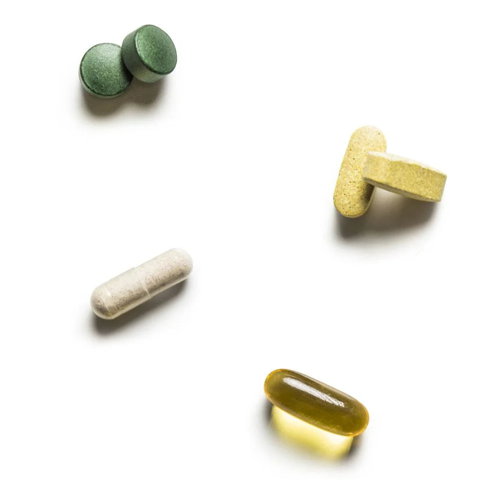 RiteStart Women daily wellness supplements including various vitamins and minerals on a white background.